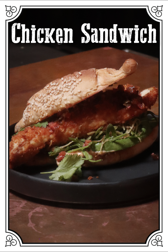 Panko Crusted Chicken Torta With Chili Mayo, Avocado, Arugula And Jalapeno-Onion Pico De Gallo  $145.00mxn
