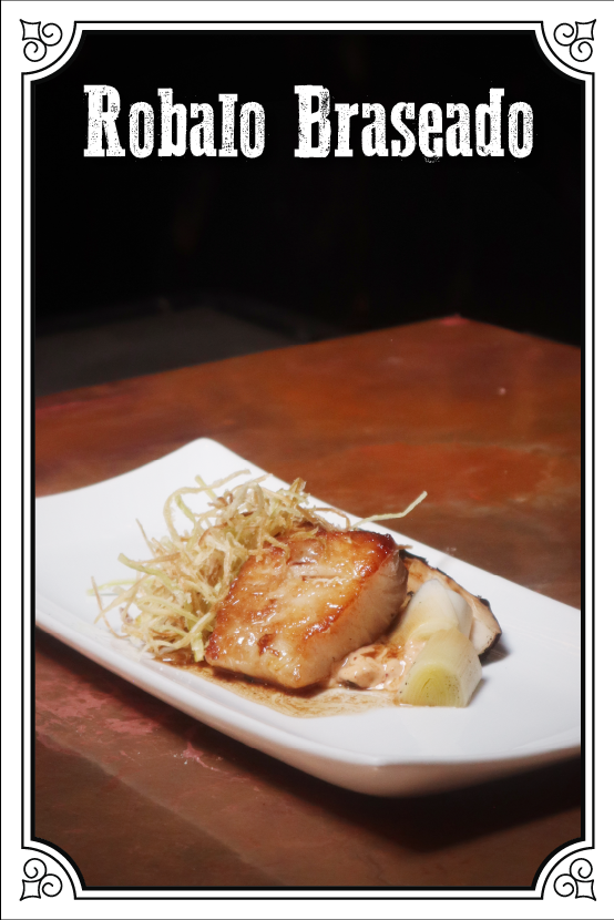 Robalo Braseado Con Poro Crujientes, Mayonesa De Chile y Miso, Salsa De Cítricos-Soya-Mantequilla-Trufa $170.00mxn